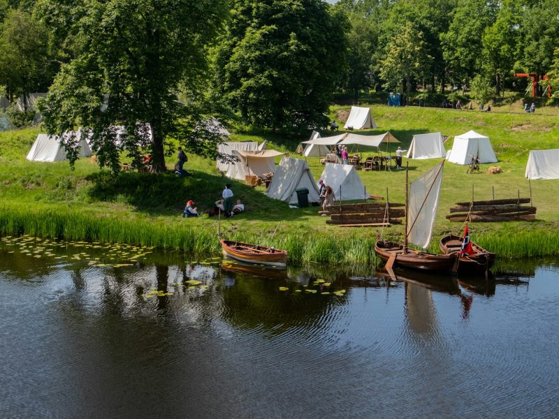 Small SVR farm campsite in Limburg with tents near meadows and river