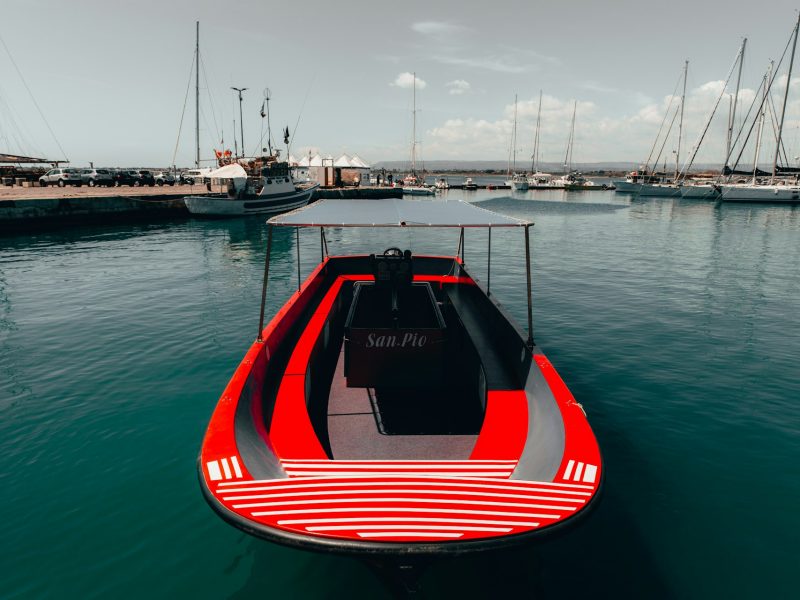 Electric sloop cruising quietly on calm water