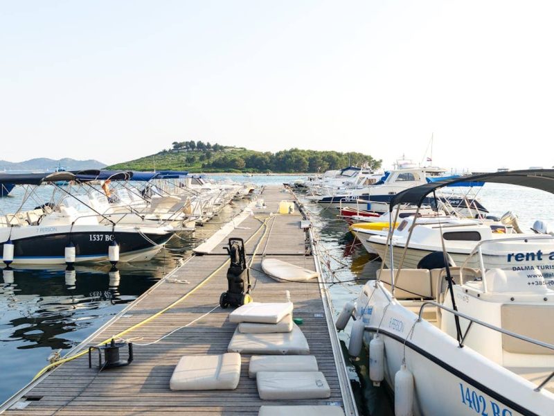 People enjoying a yacht trip along the Ibiza coastline on a sunny holiday