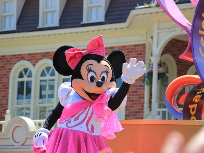 Exterior view of a family hotel near Disneyland Paris with shuttle bus in front