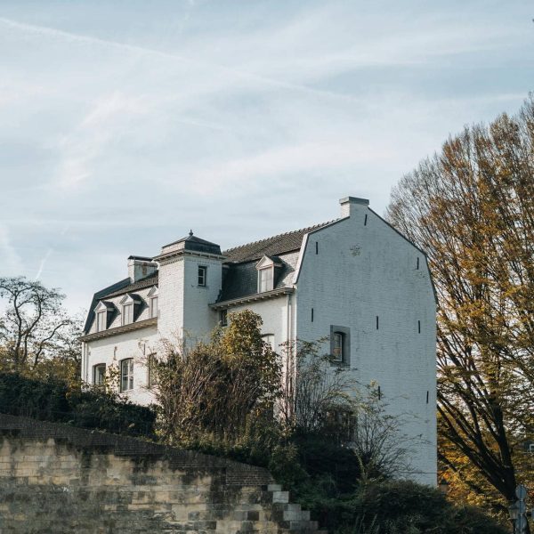 Green hills, village and walking trail in South Limburg on a sunny holiday day