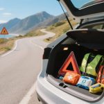 Car emergency equipment: jack, tow rope, and first aid kit