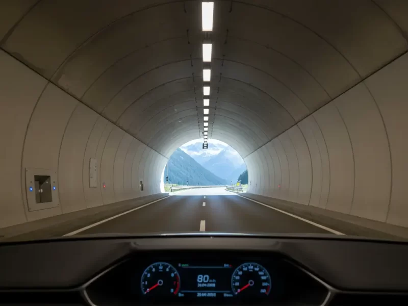 The illuminated interior of a road tunnel.